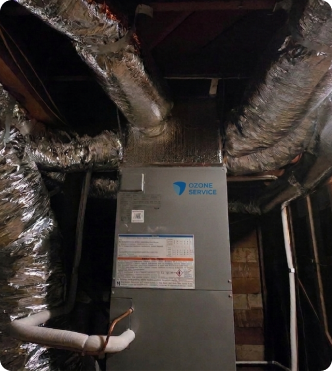 Heat pump outdoor unit installed next to a residential building.