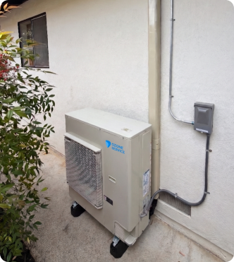 Heat pump unit mounted outside a home.